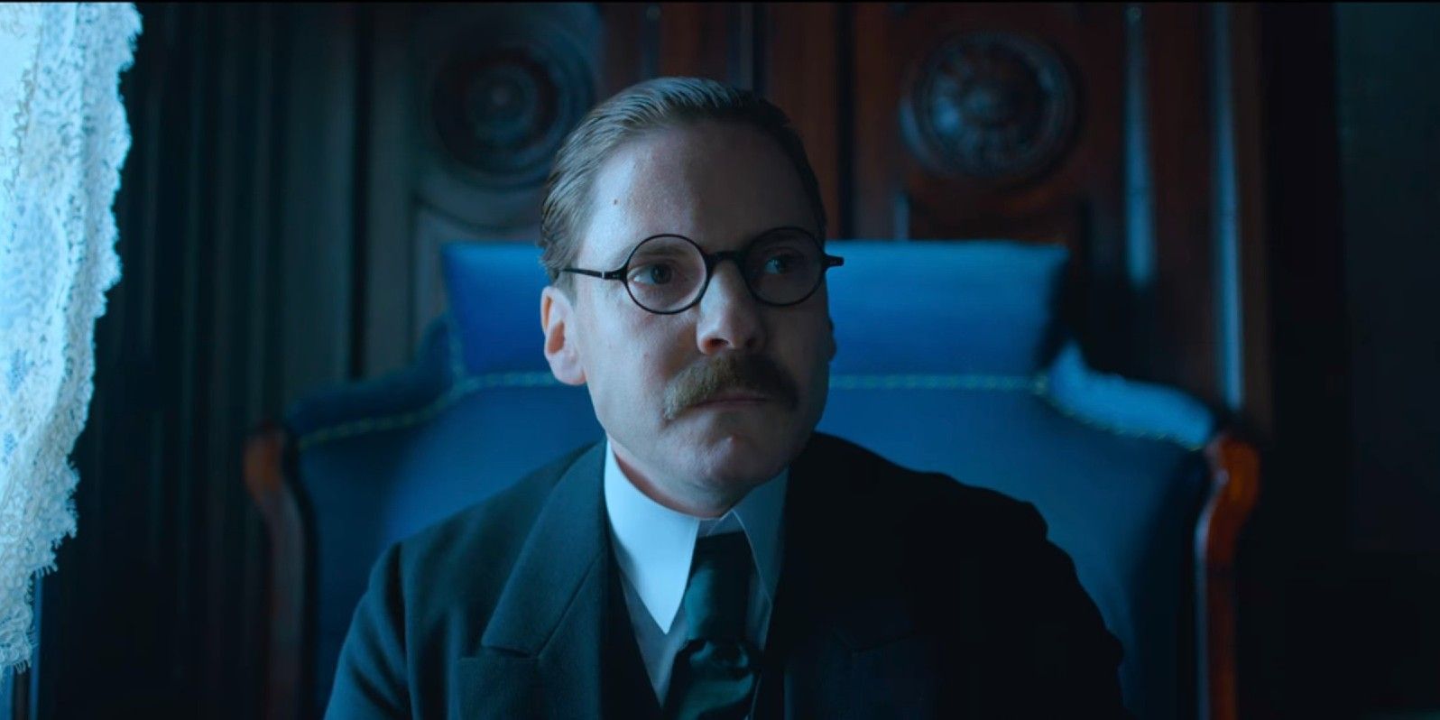 Matthias sitting in a chair in All Quiet on the Western Front