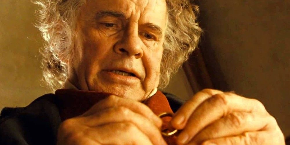 Bilbo holding the One Ring in Lord of the Rings. 