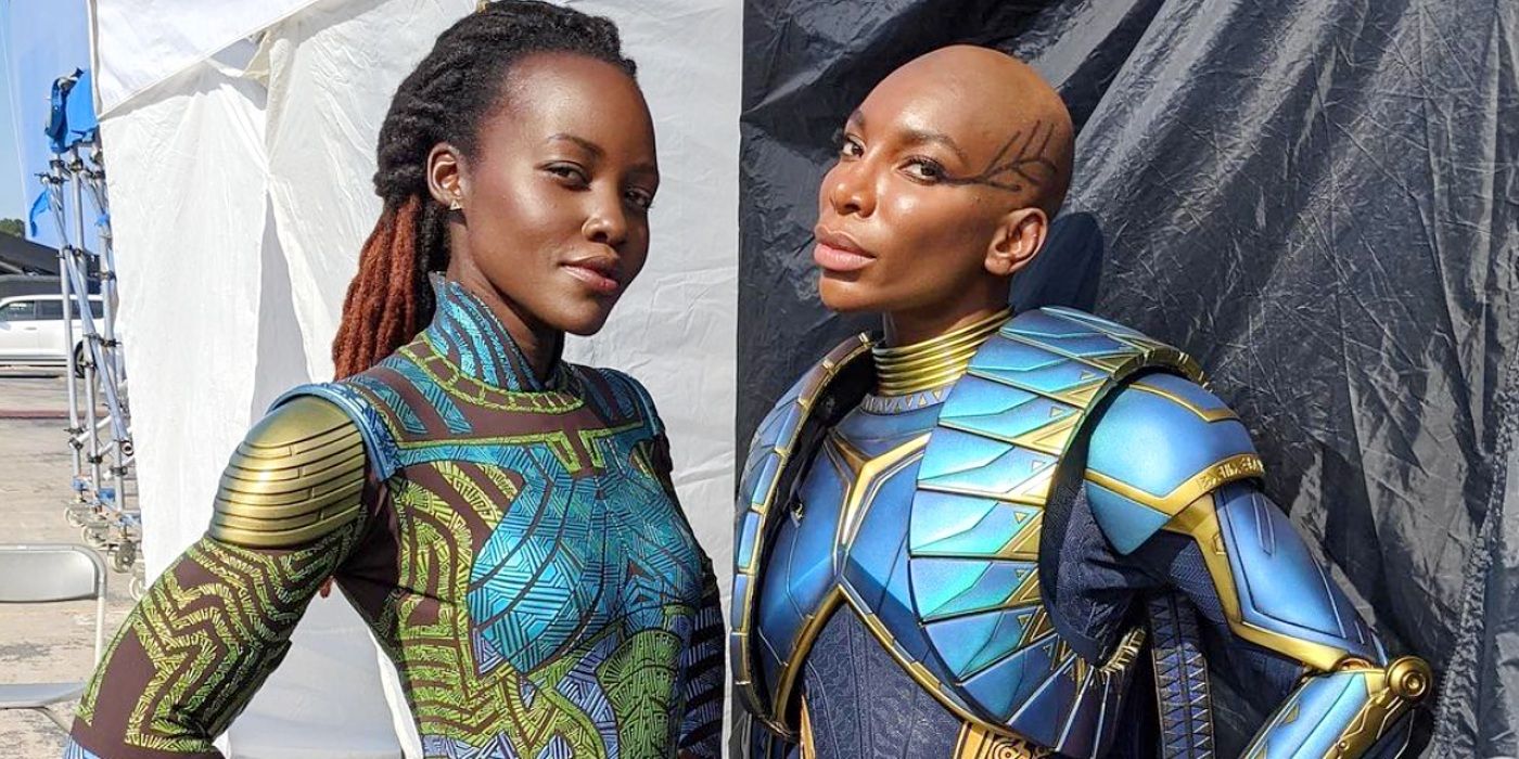 Lupita Nyong'o and Michaela Coel posing in costume on set of Black Panther: Wakanda Forever.