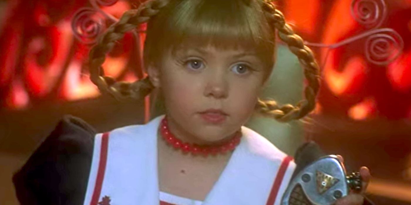 Cindy Lou holding up a recording device in How the Grinch Stole Christmas. 