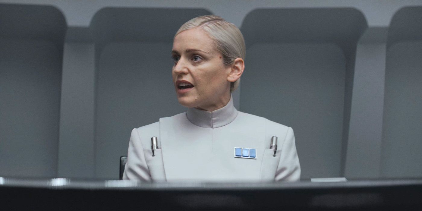 Denise Gough as Dedra Meero in Andor in a stark Imperial uniform giving an impassioned presentation