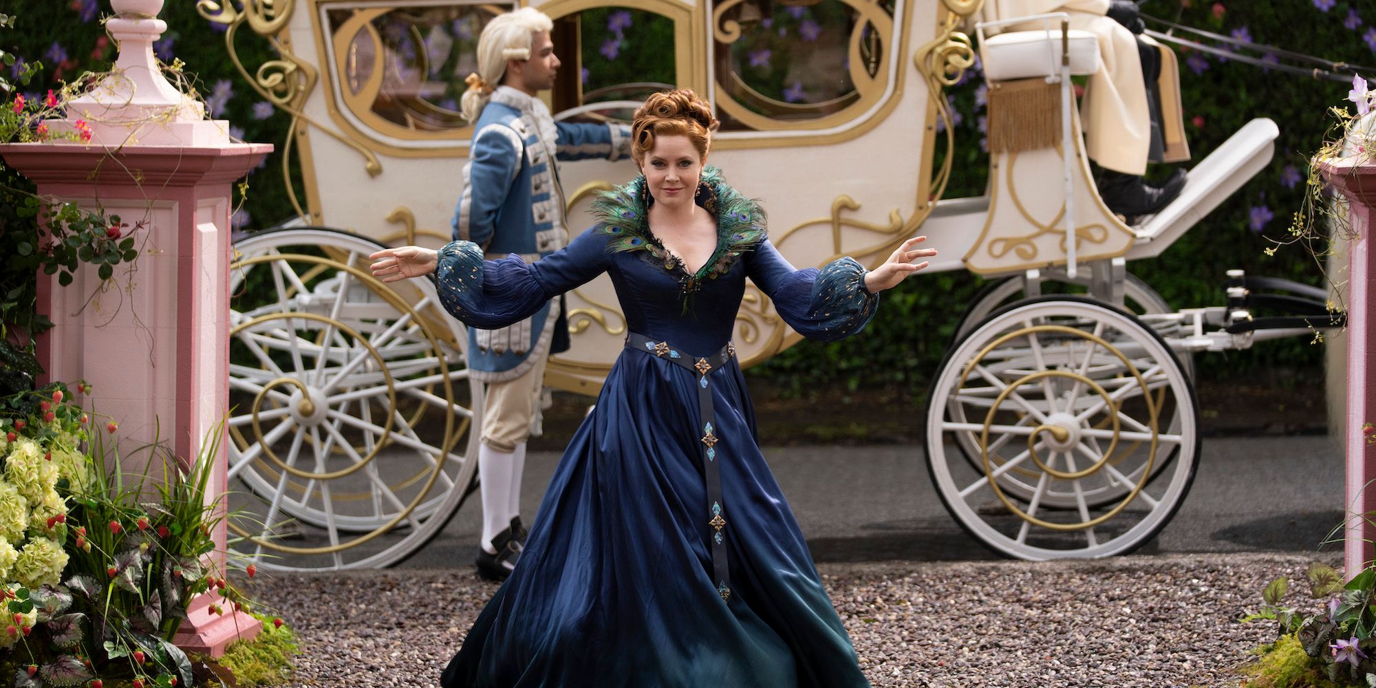Giselle stands in front of a carriage from Disenchanted 