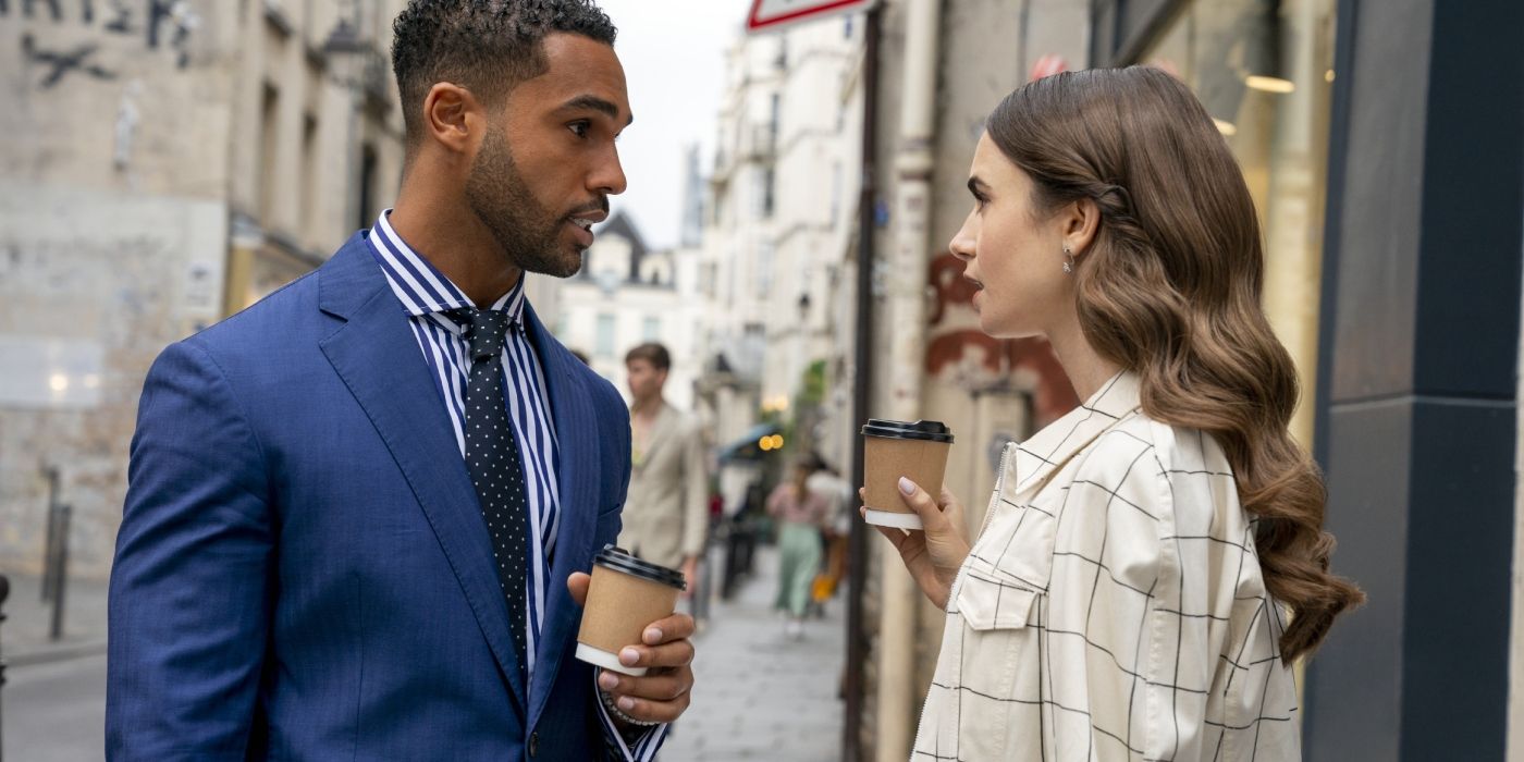 Alfie holding coffee and talking to Emily outside in Emily In Paris