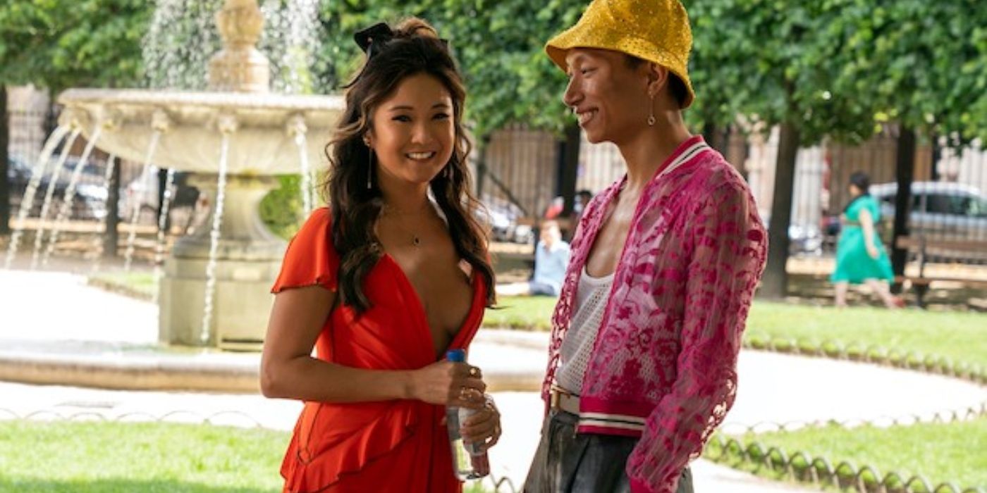 Mindy and Etienne talking in a park in Emily In Paris