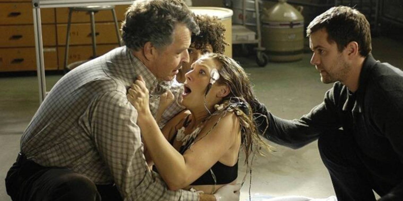Anna Torv clings to John Noble with Joshua Jackson comforting her in Fringe