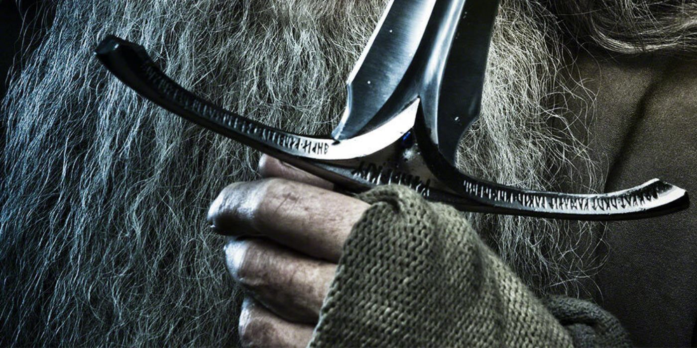 Gandalf's hand holding his sword Glamdring from Lord of the Rings 