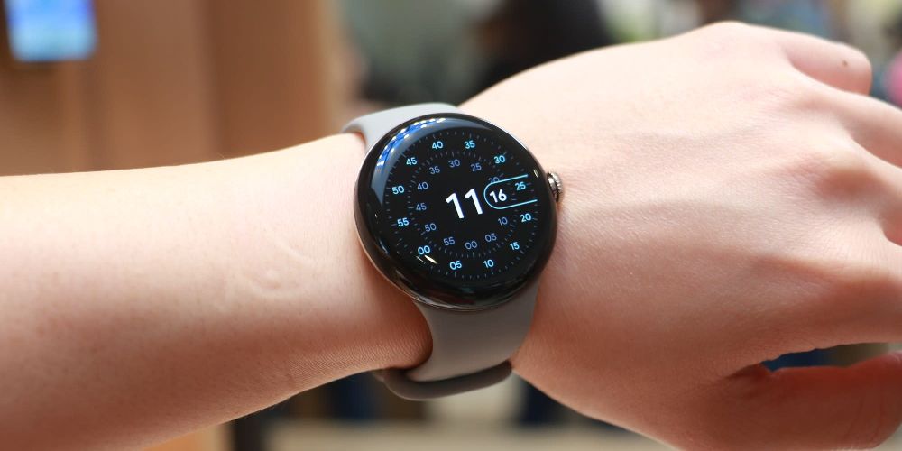 The Pixel Watch strapped on a person's hand