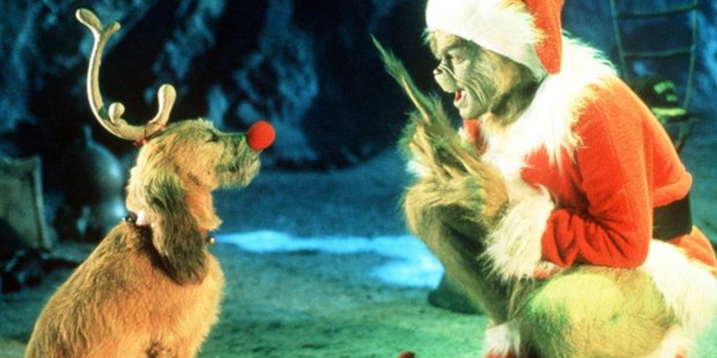 O Grinch vestido de Papai Noel conversando com seu cachorro Max vestido de Rudolph em How The Grinch Stole Christmas. 