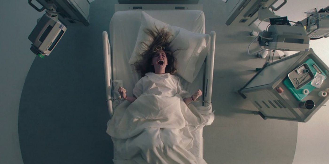 An overhead view of a pregnant Esther chained in a hospital bed, screaming on The Handmaid&rsquo;s Tale