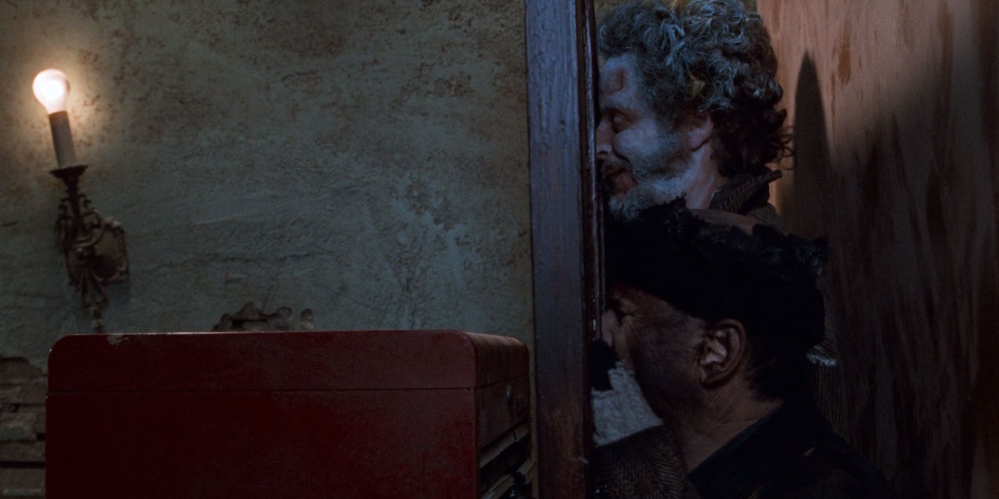 Harry and Marv being crushed by a tool chest and door in Home Alone 2 Lost In New York (1991)