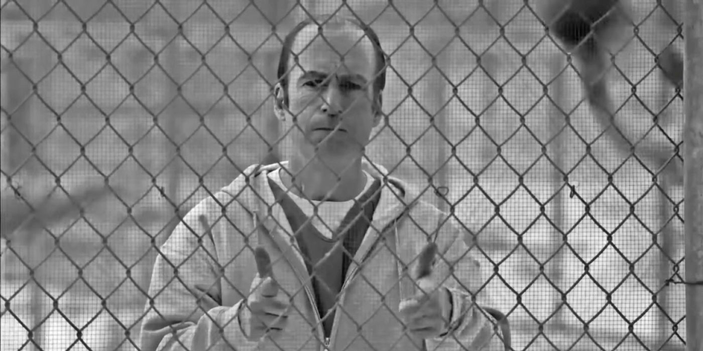 Bob Odenkirk as Jimmy McGill doing finger guns behind bars in Better Call Saul's series finale