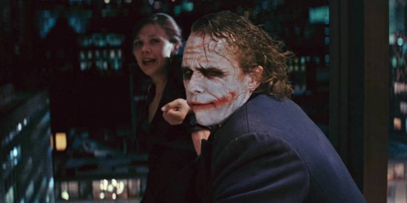 Joker (Heath Ledger) threatens Rachel (Maggie Gyllenhaal) in The Dark Knight