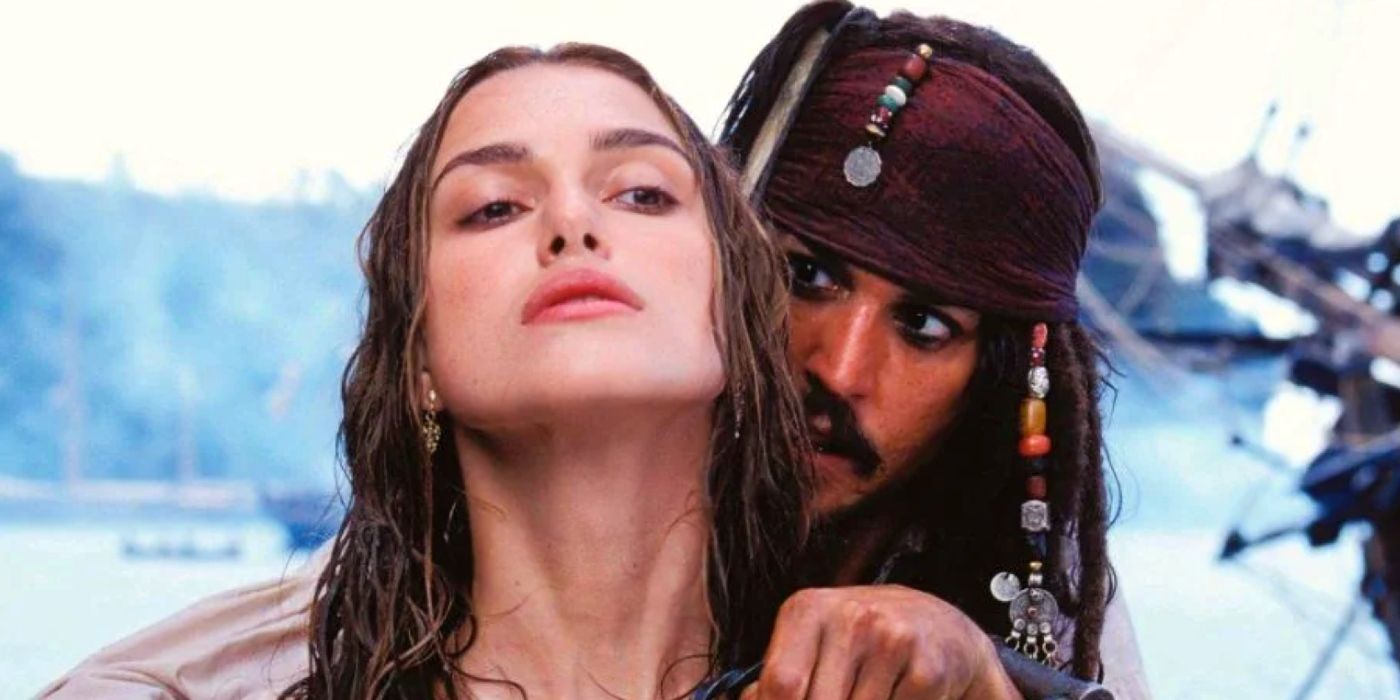 Jack Sparrow holds a chain around Elizabeth Swann's neck in Pirates of the Caribbean: The Curse of the Black Pearl.