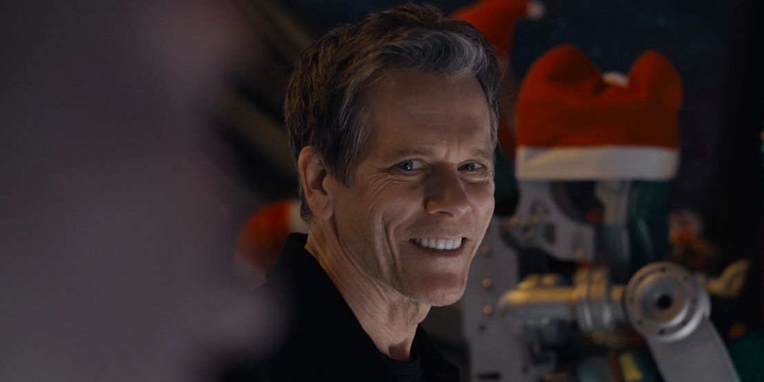 Kevin Bacon smiling at Drax in The Guardians of the Galaxy Holiday Special 