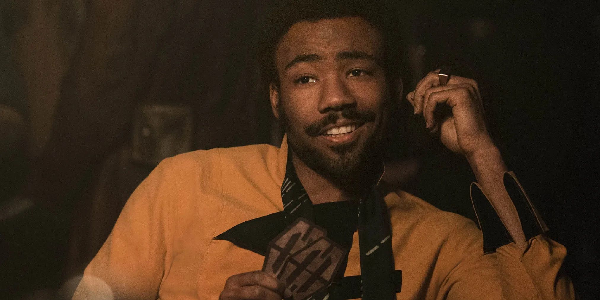 Donald Glover as Lando Calrissian playing sabacc in Solo: A Star Wars Story