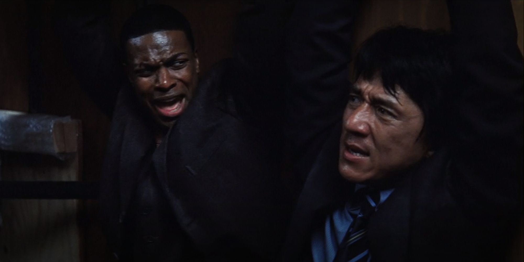 Lee and Carter tied up together in a trailer in Rush Hour 2