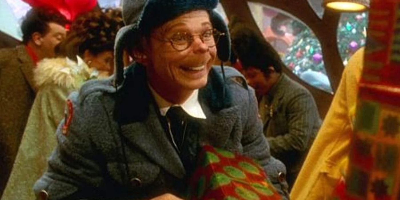 Lou Lou Who holding a present in How the Grinch Stole Christmas. 
