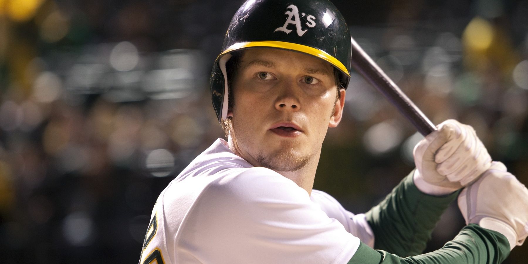 Chris Pratt batting in a crowded stadium in Moneyball