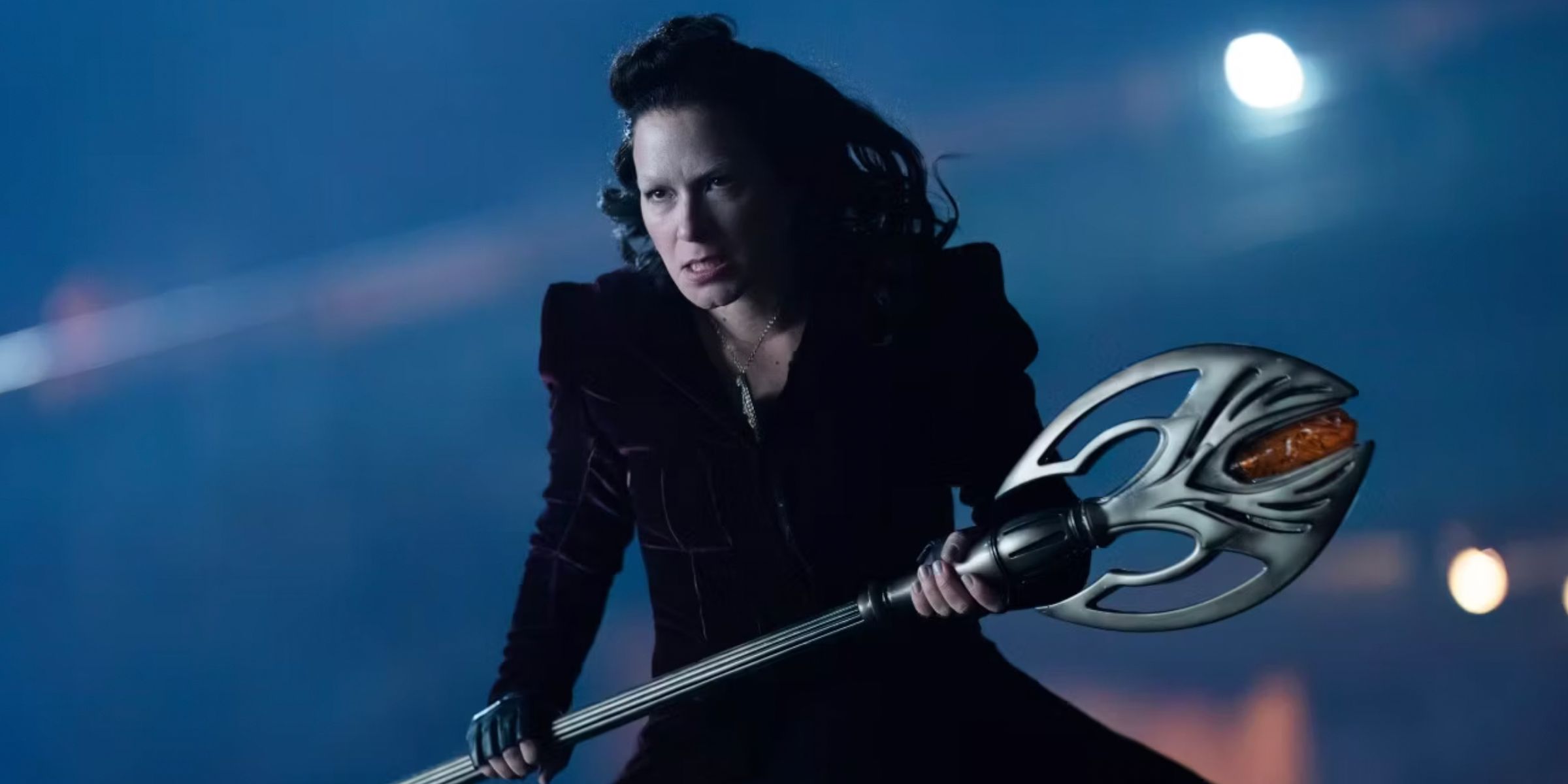 Mother Mayhem holding her staff in Titans