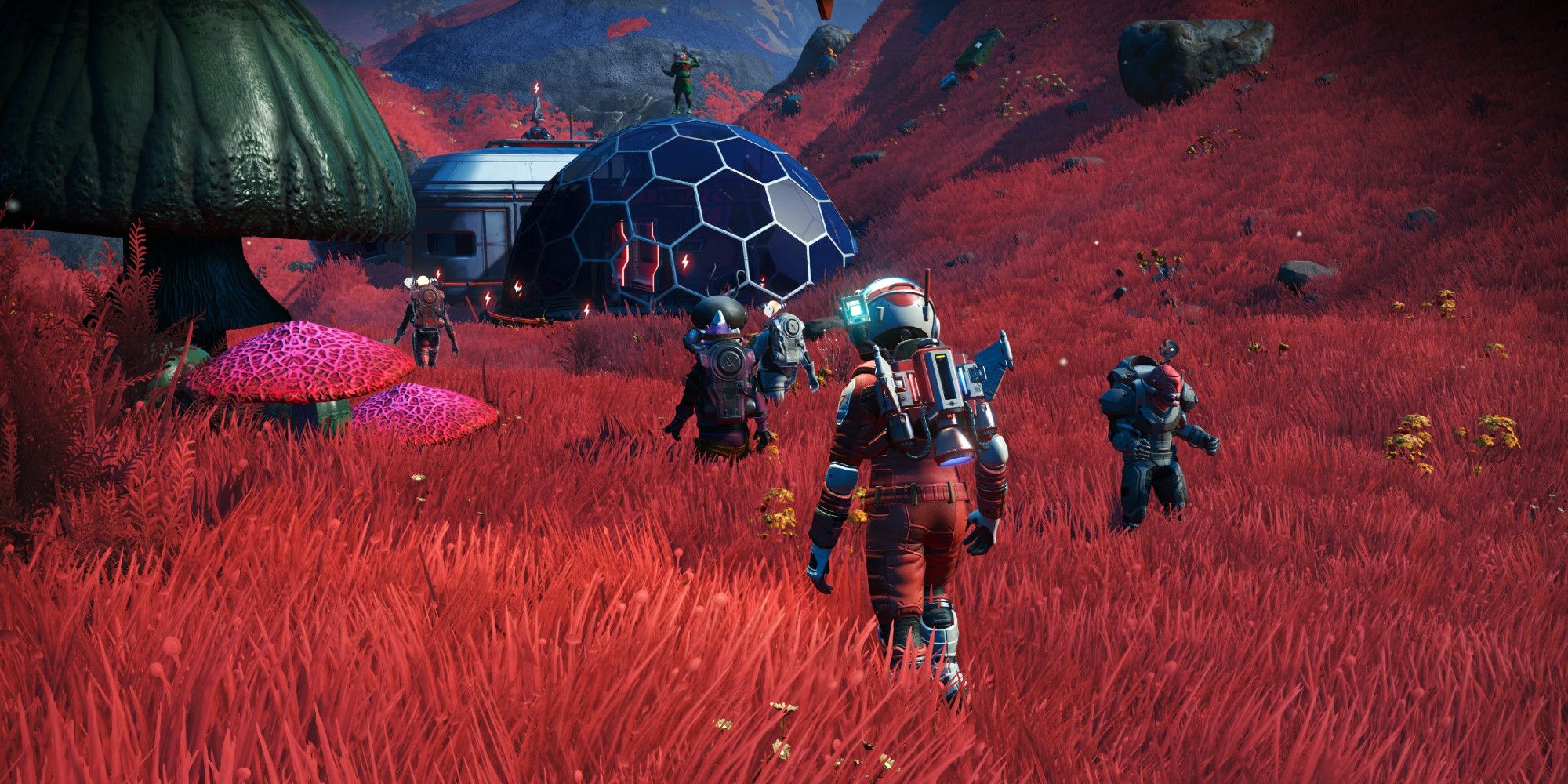 Screenshot of a group of No Man's Sky players standing around a base on an alien planet