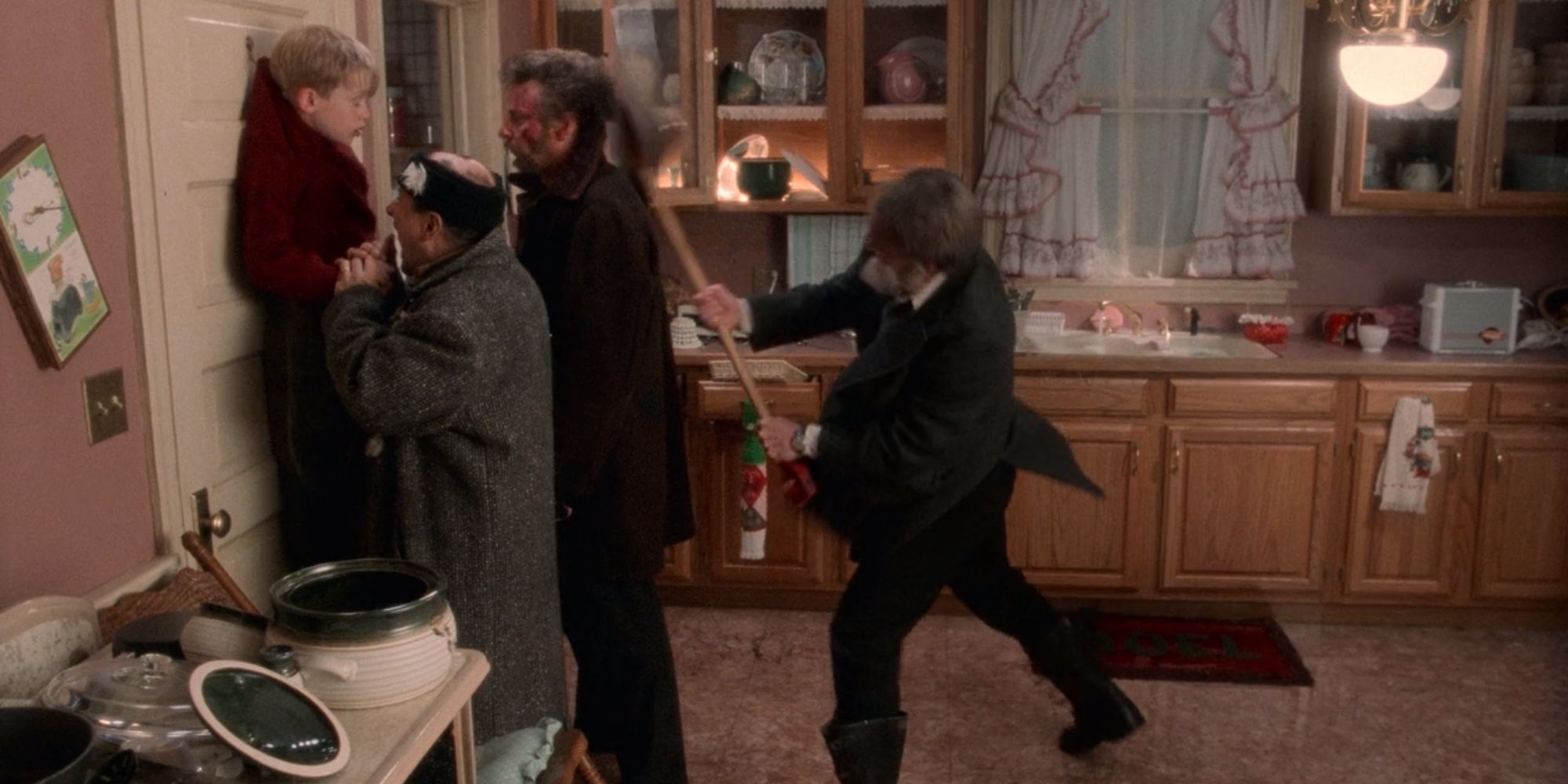 Old Man Marley hitting Marv with a shovel in Home Alone (1990)