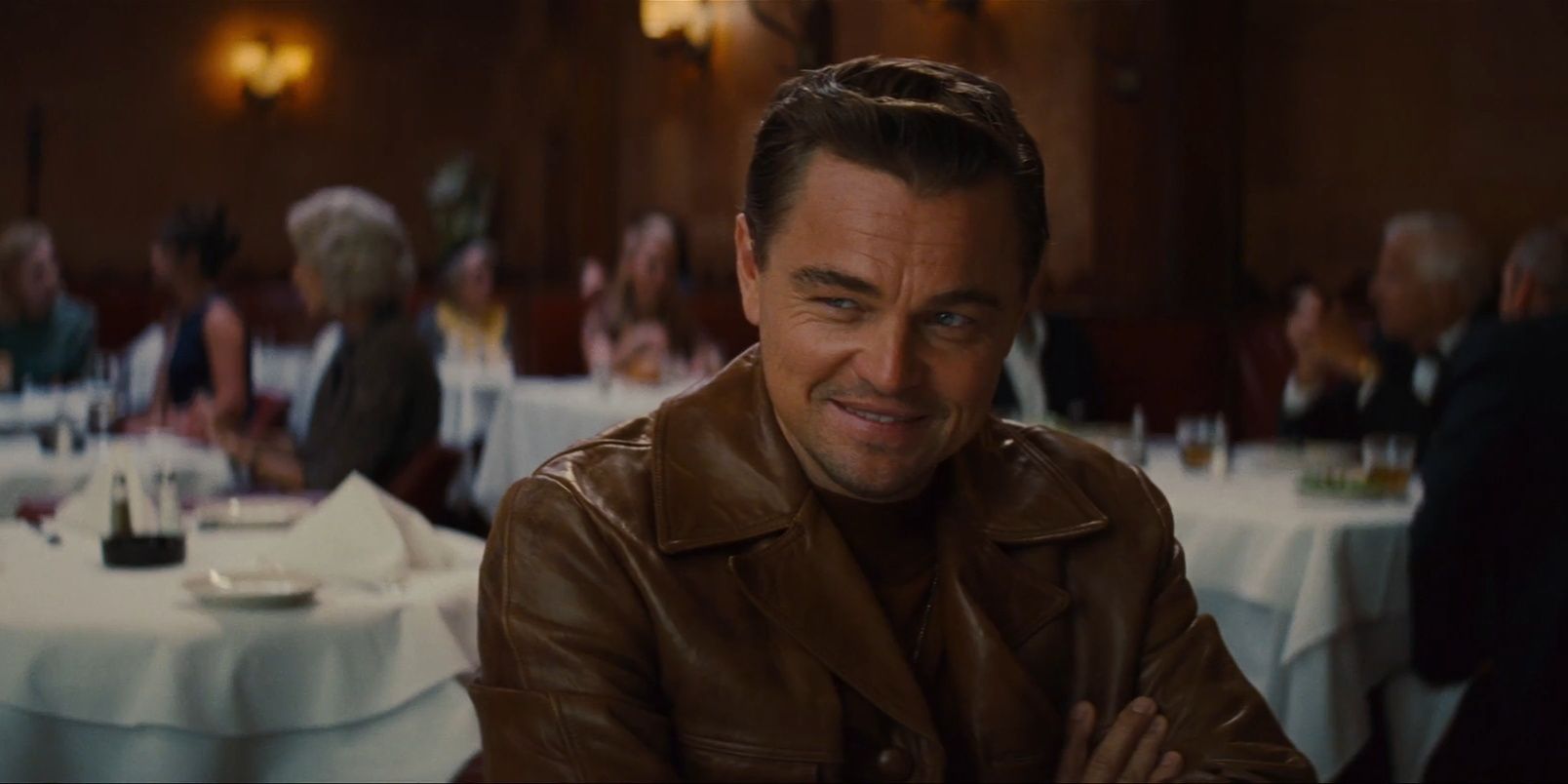 Rick Dalton smiling in a restaurant in Once Upon a Time in Hollywood 