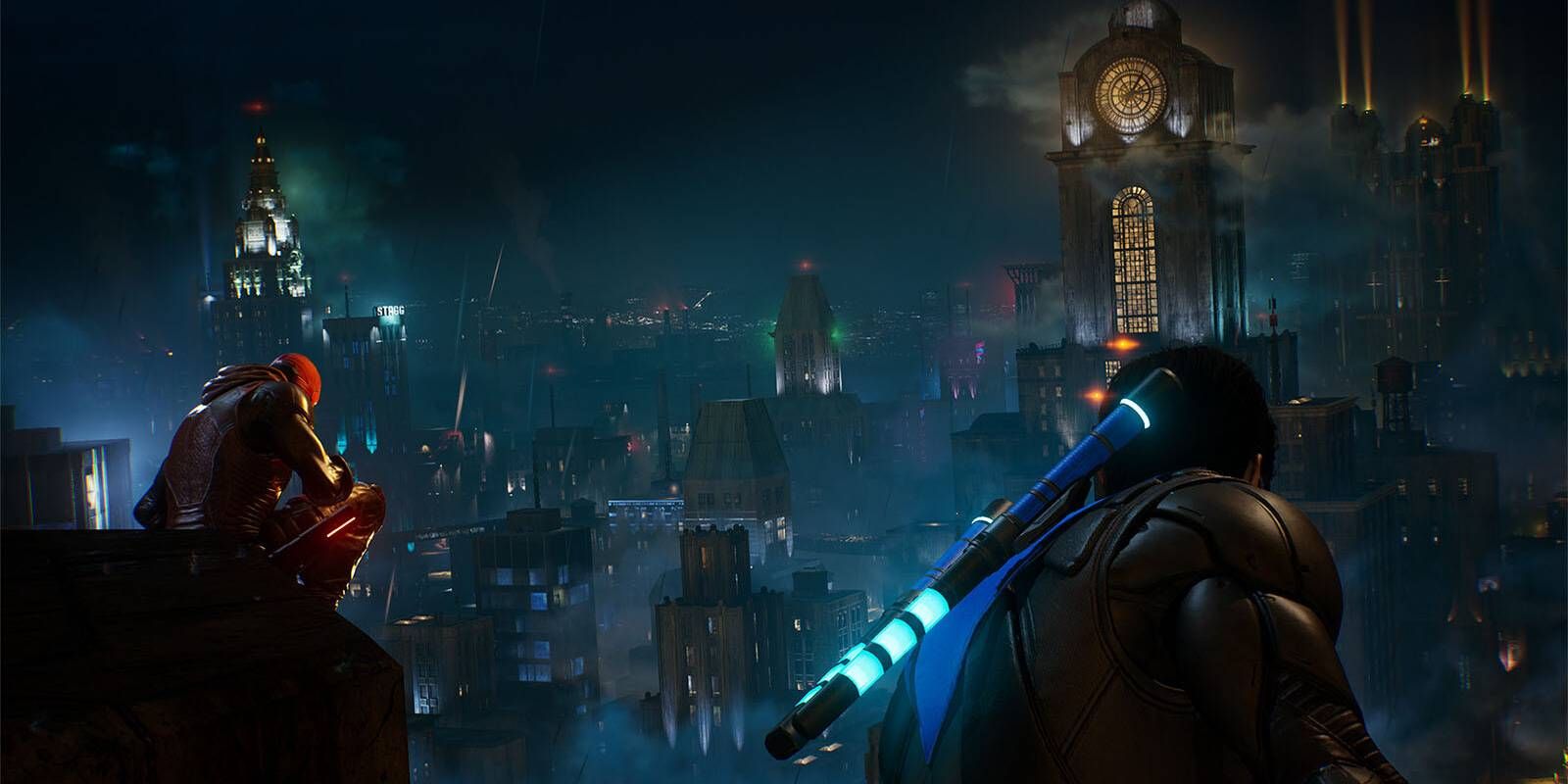 Red Hood and Nightwing perched atop a Gotham City building in Gotham Knights.