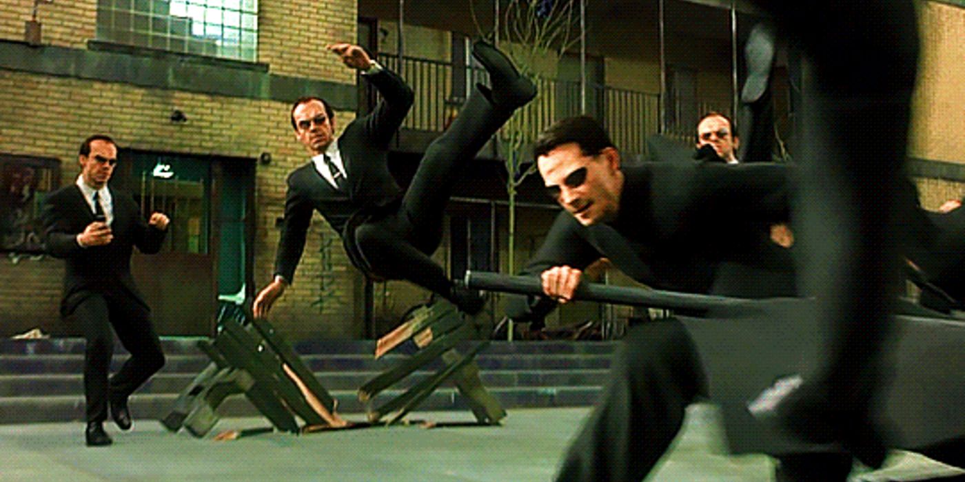 Neo fights an infinite wave of Agent Smiths with a metal pole in The Matrix Reloaded's burly brawl scene