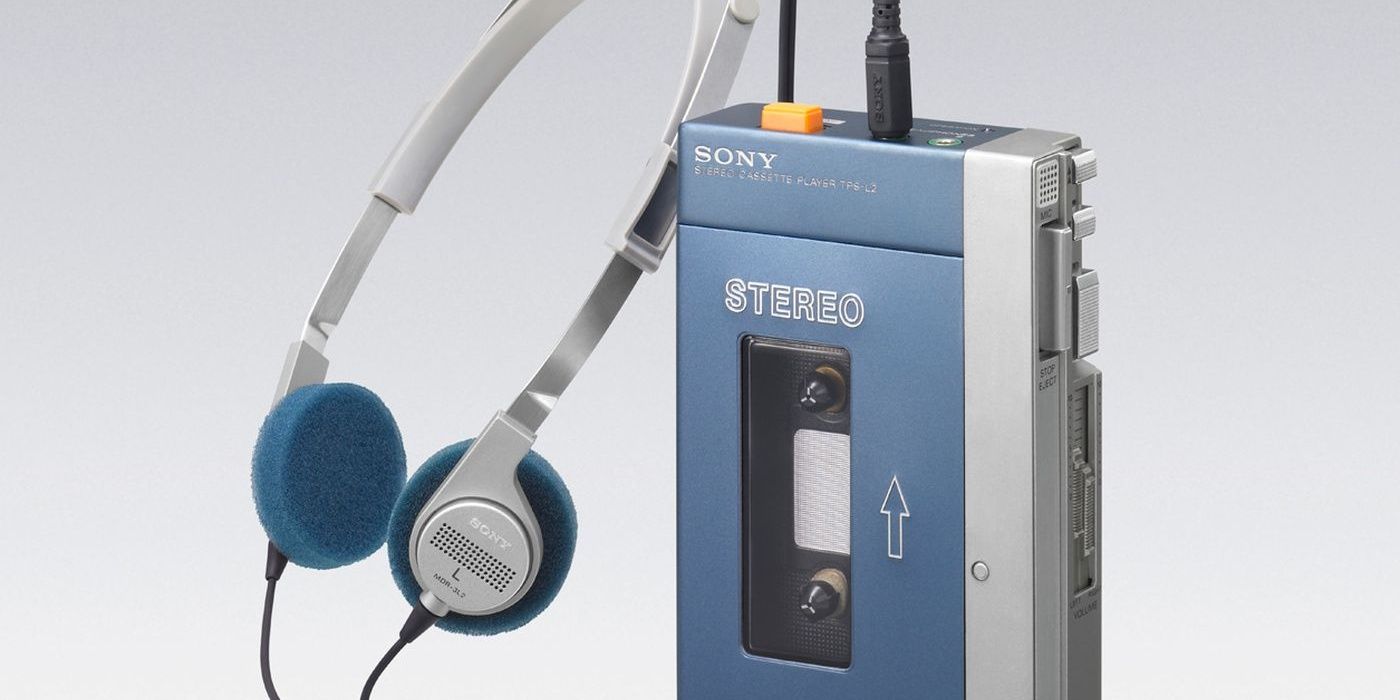 Blue and silver Sony Walkman with headphones attached