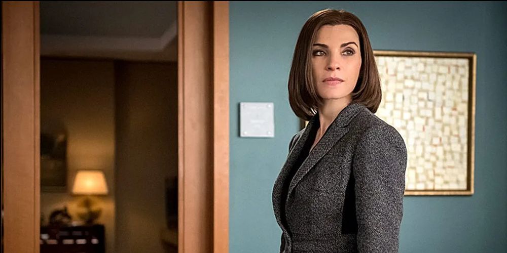 Alicia stands by a door in The Good Wife