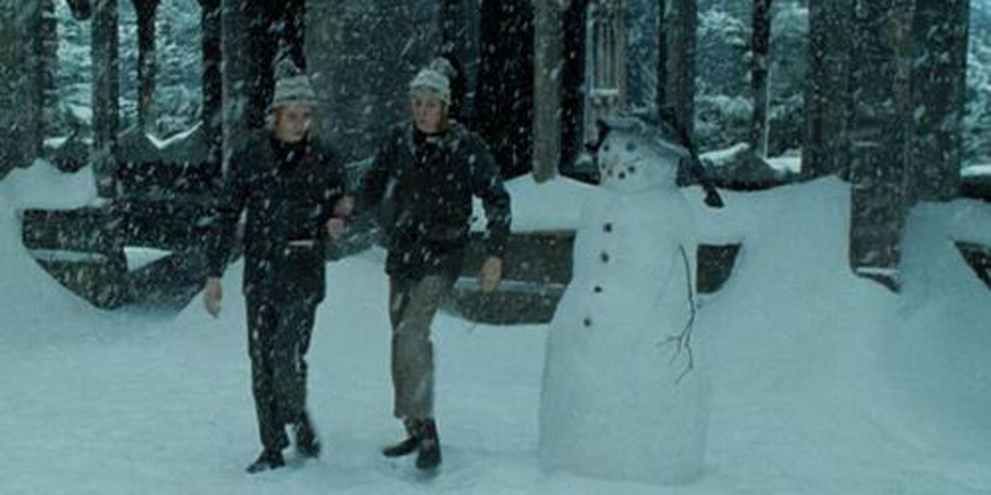 The Weasley Twins make a snowman.