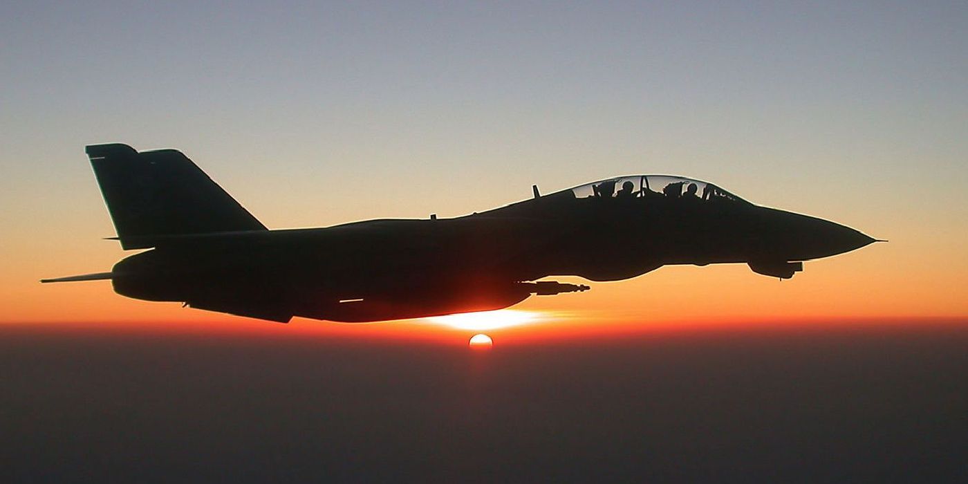 A fighter jet flies over the horizon in Top Gun Maverick 