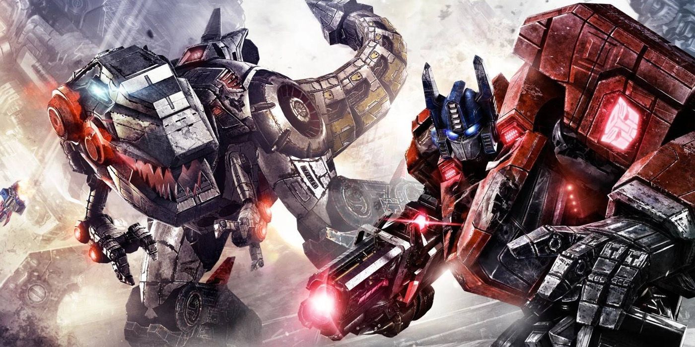 A promotional image for Transformers: Fall of Cybertron featuring Optimus Prime and Grimlock.