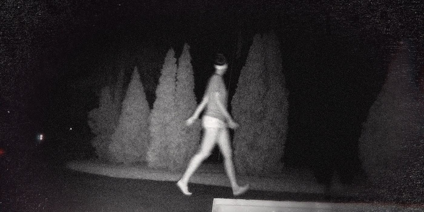 A dark security camera video of Tiffany Valiante walking outside from Unsolved Mysteries.