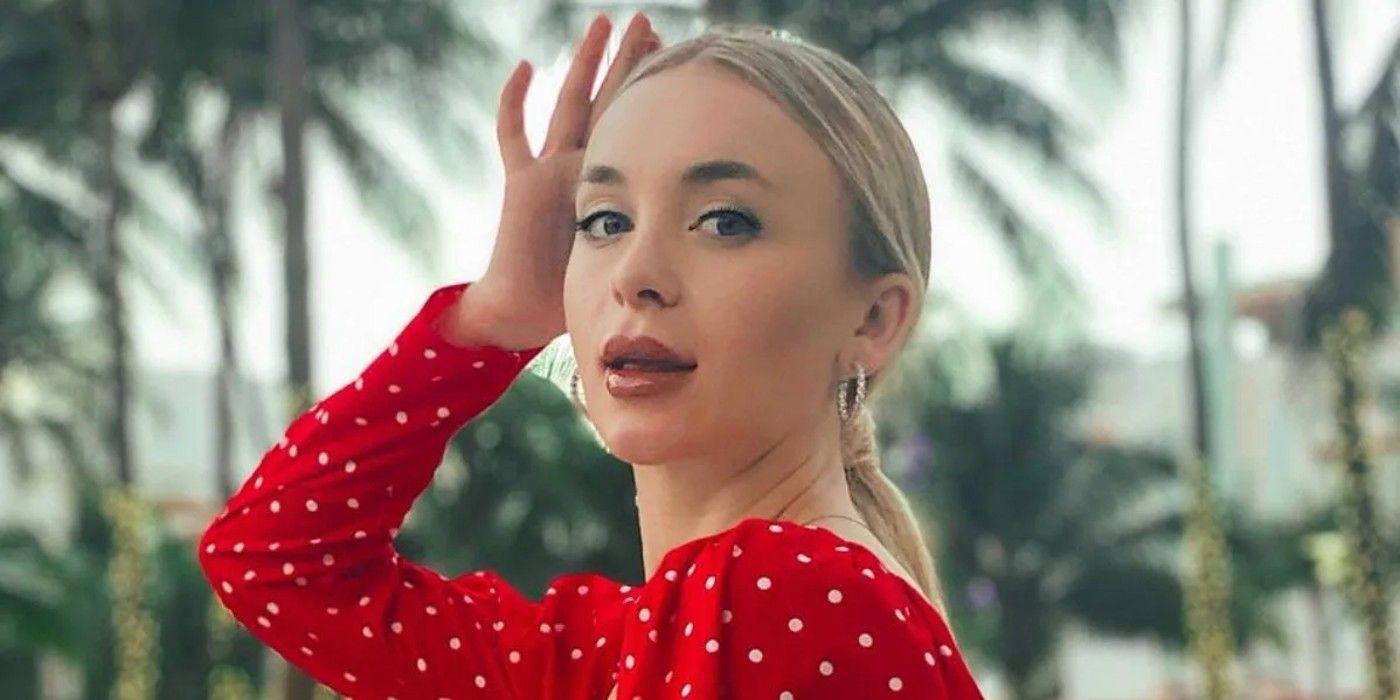 Yara Zaya from 90 Day Fiancé posing with hand on head in red polka dot shirt