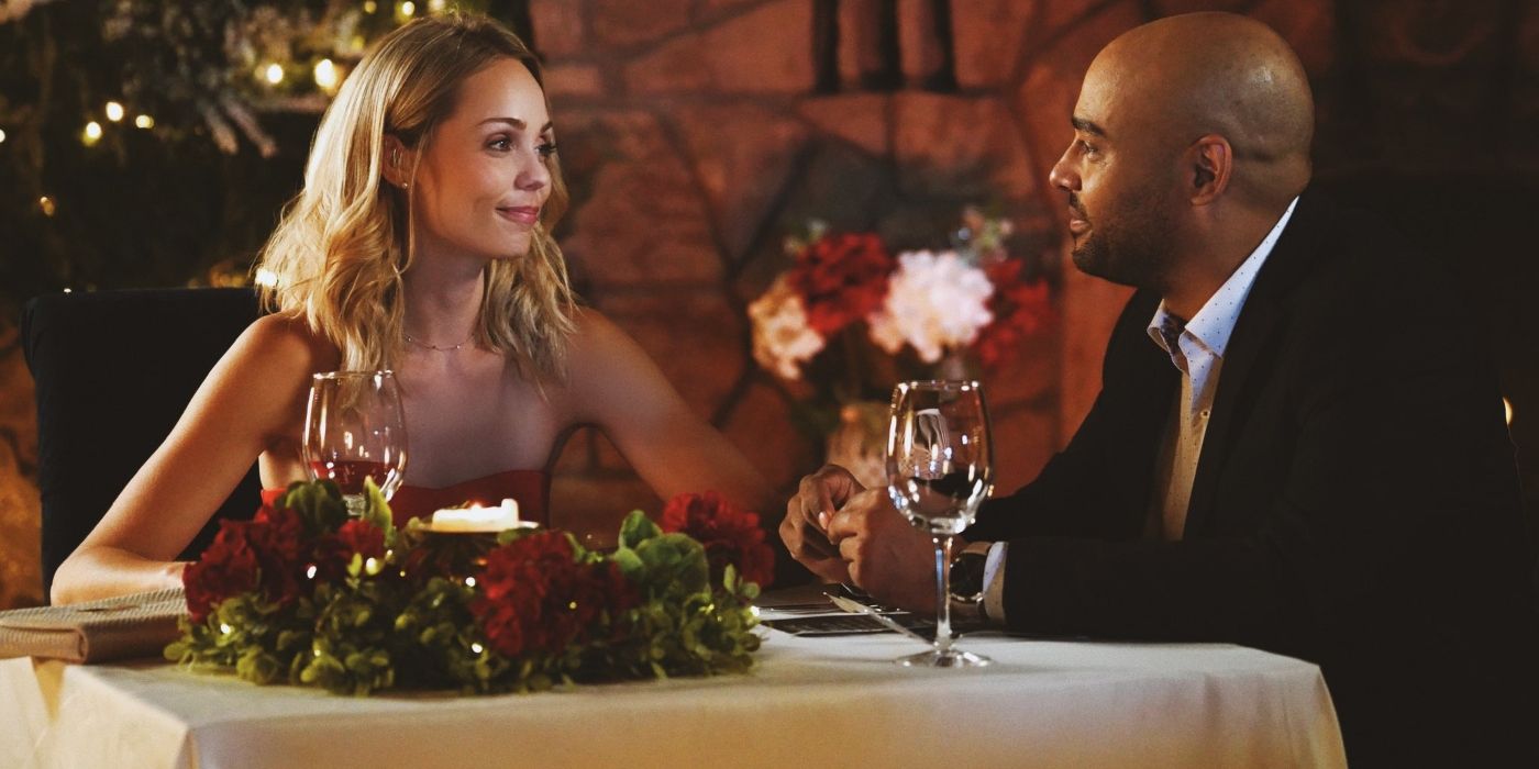 Molly and Patrick sitting at a restaurant table in A Christmas Exchange