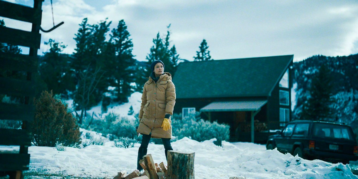 A woman standing outside in the snow in God's Country