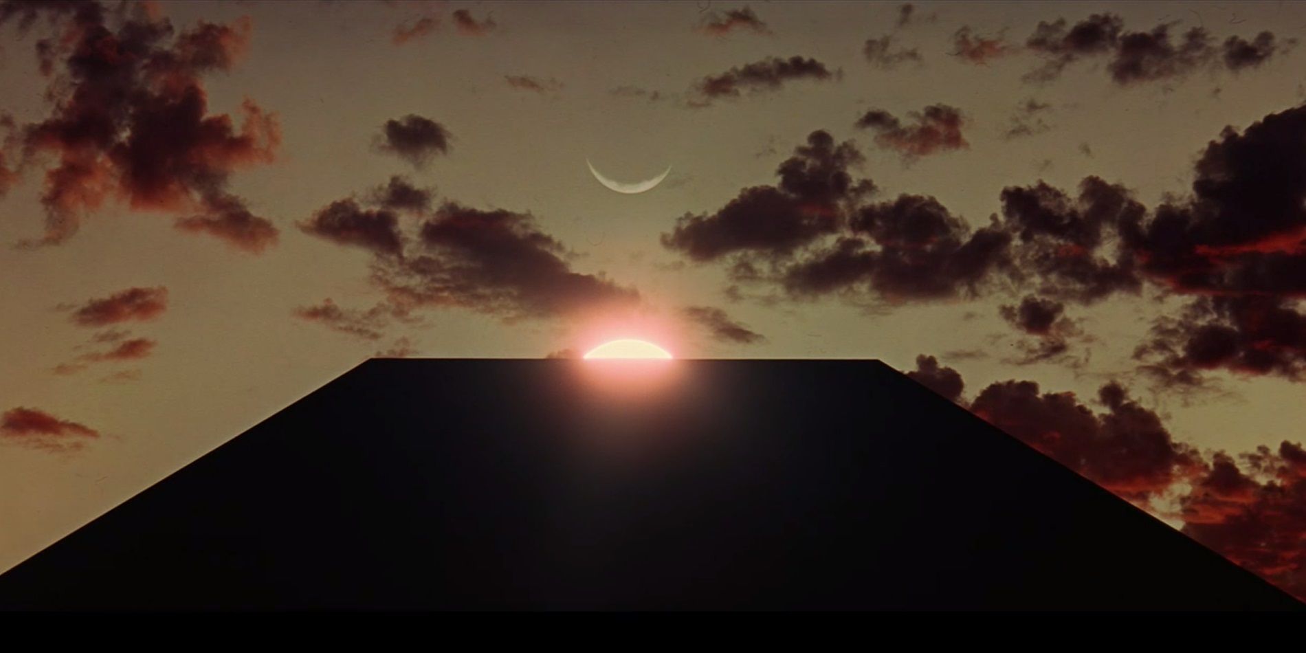 A monolith below the sun in 2001: A Space Odyssey.
