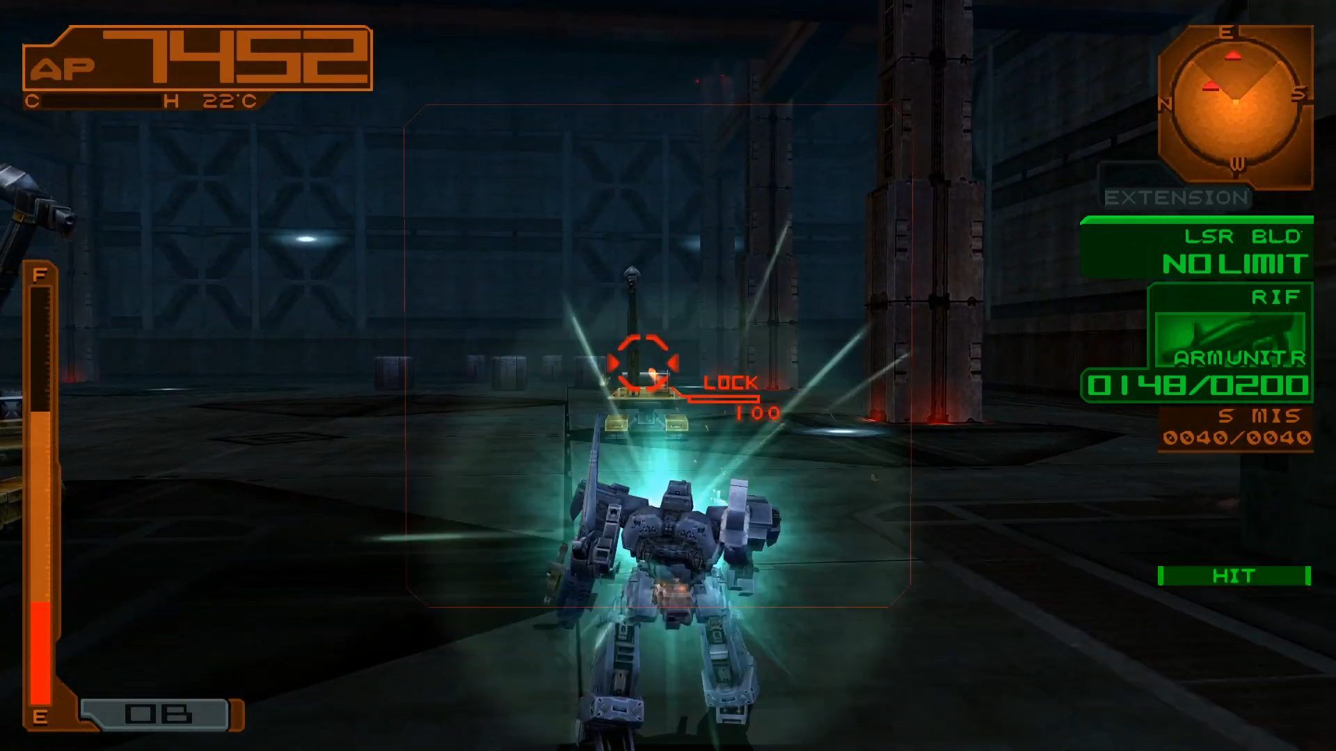 A blue Armored Core mech is seen glowing blue while fighting a machine that looks like a large construction vehicle while in a empty metal factory.