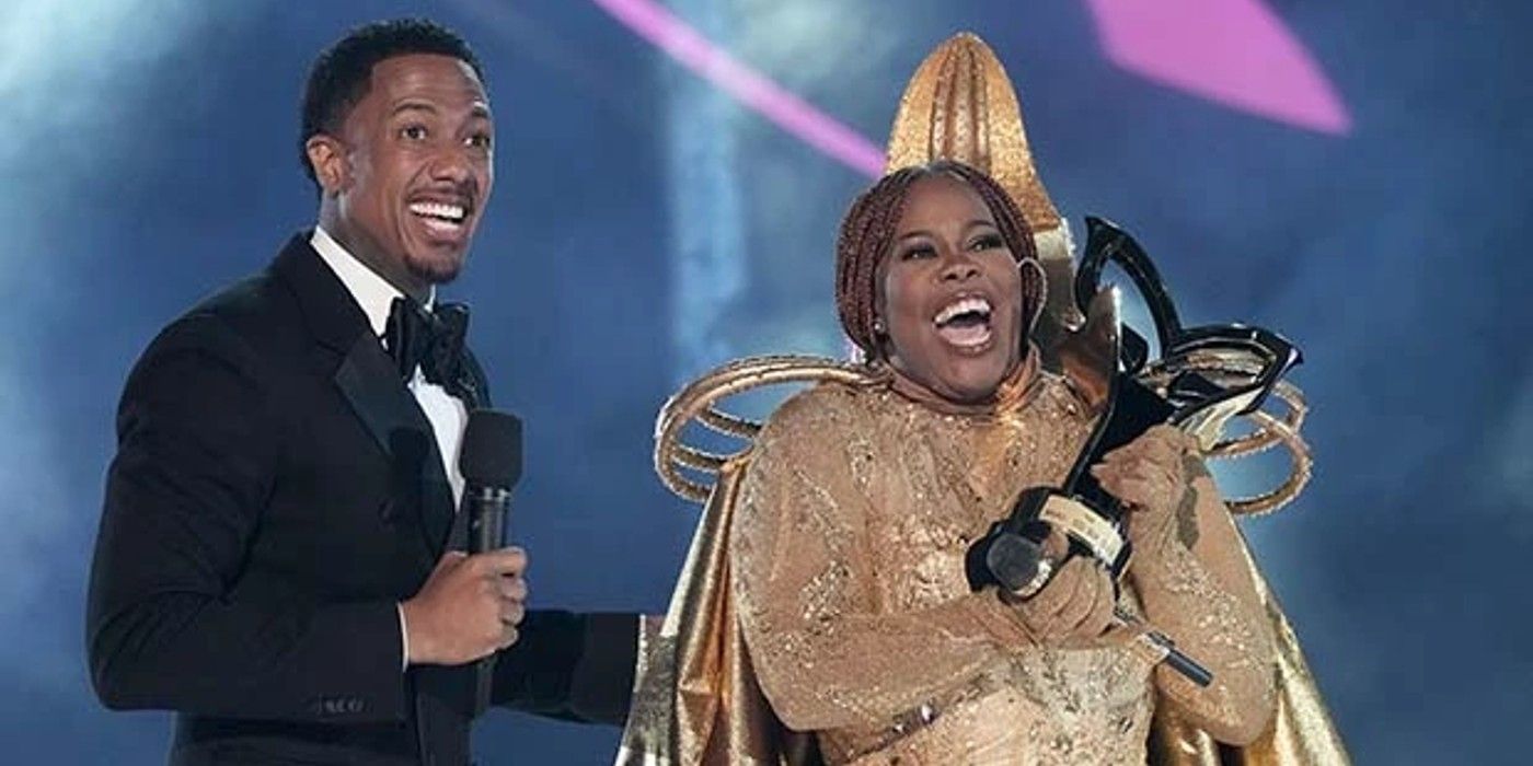 Amber Riley Winner The Masked Singer onstage with Nick Cannon