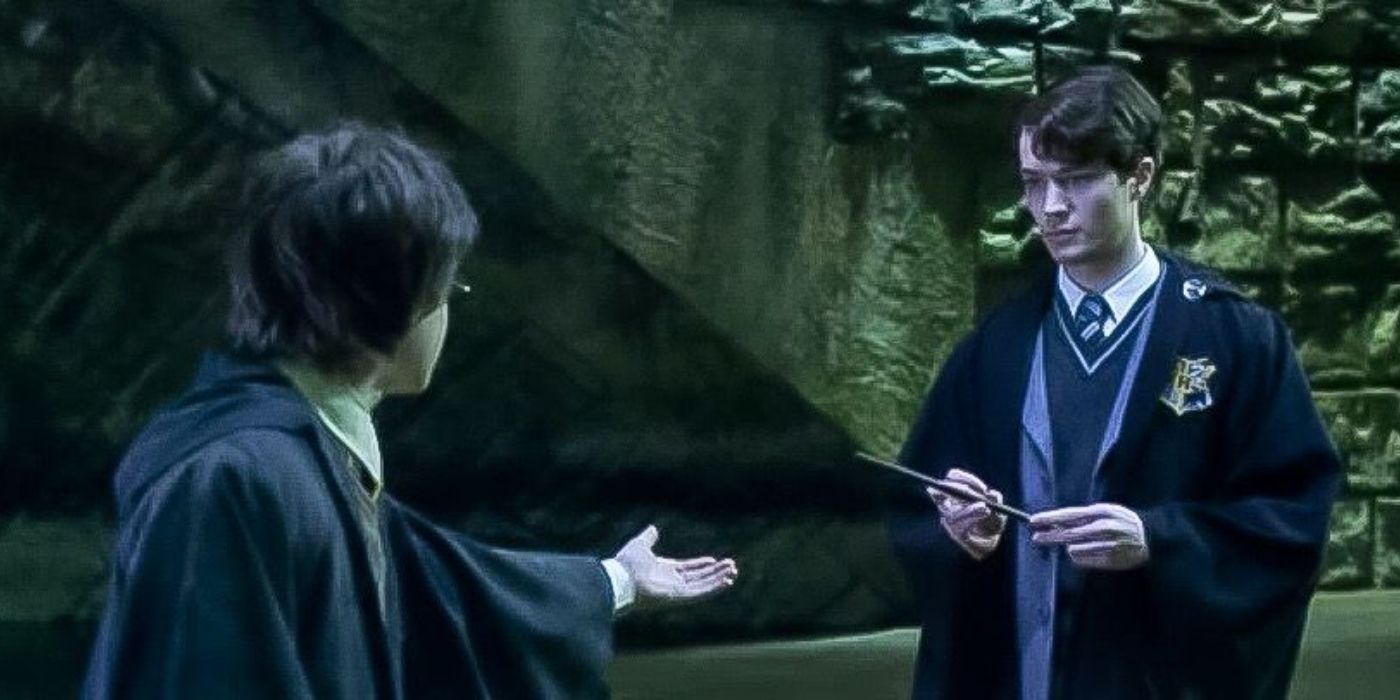 An image of Harry asking Tom Riddle for the wand in Harry Potter and The Chamber of Secrets