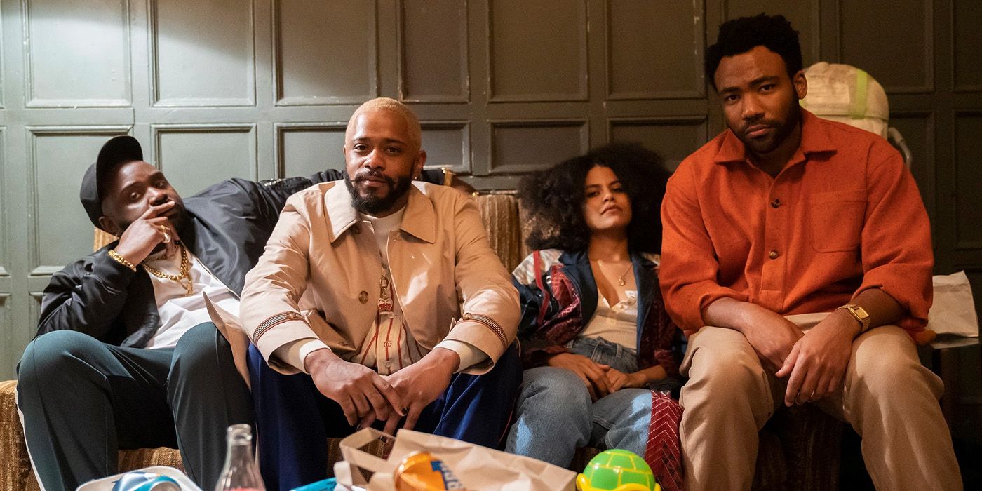 The cast of Atlanta pose for a promo image on a couch