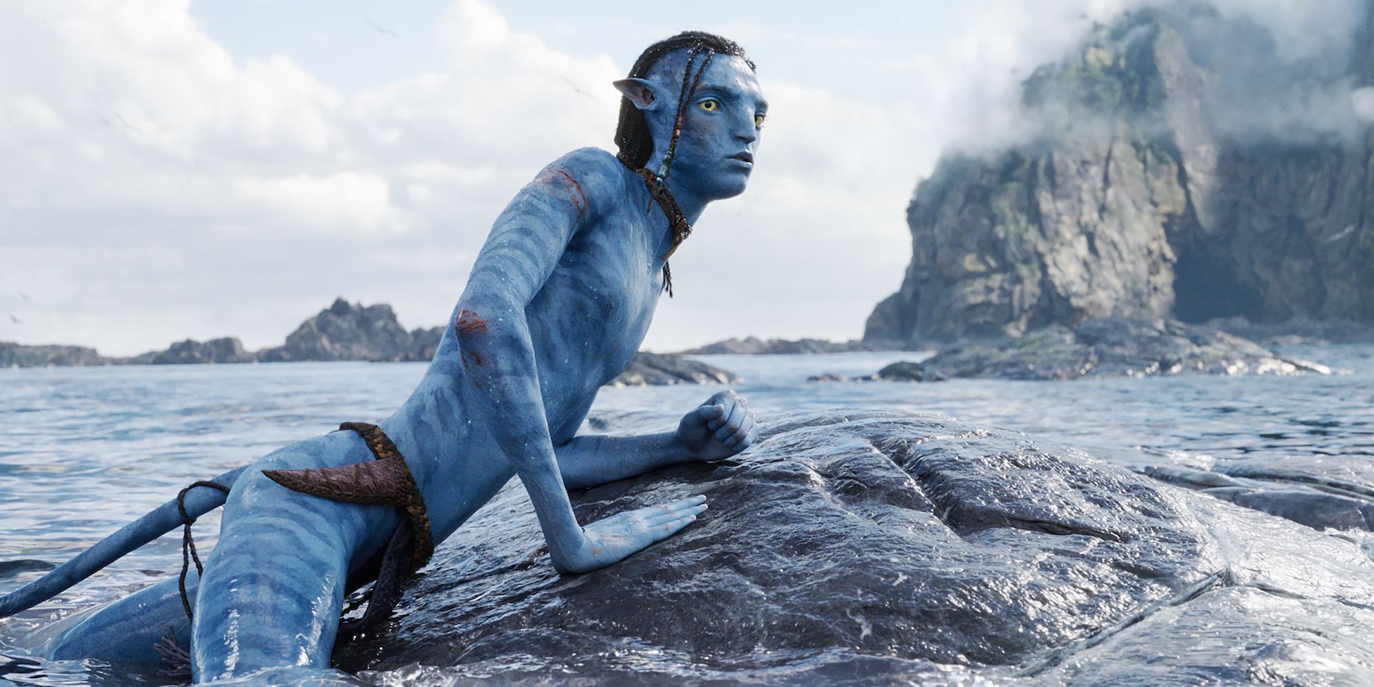 Avatar The Way of Water Lo'ak perched on rock in water