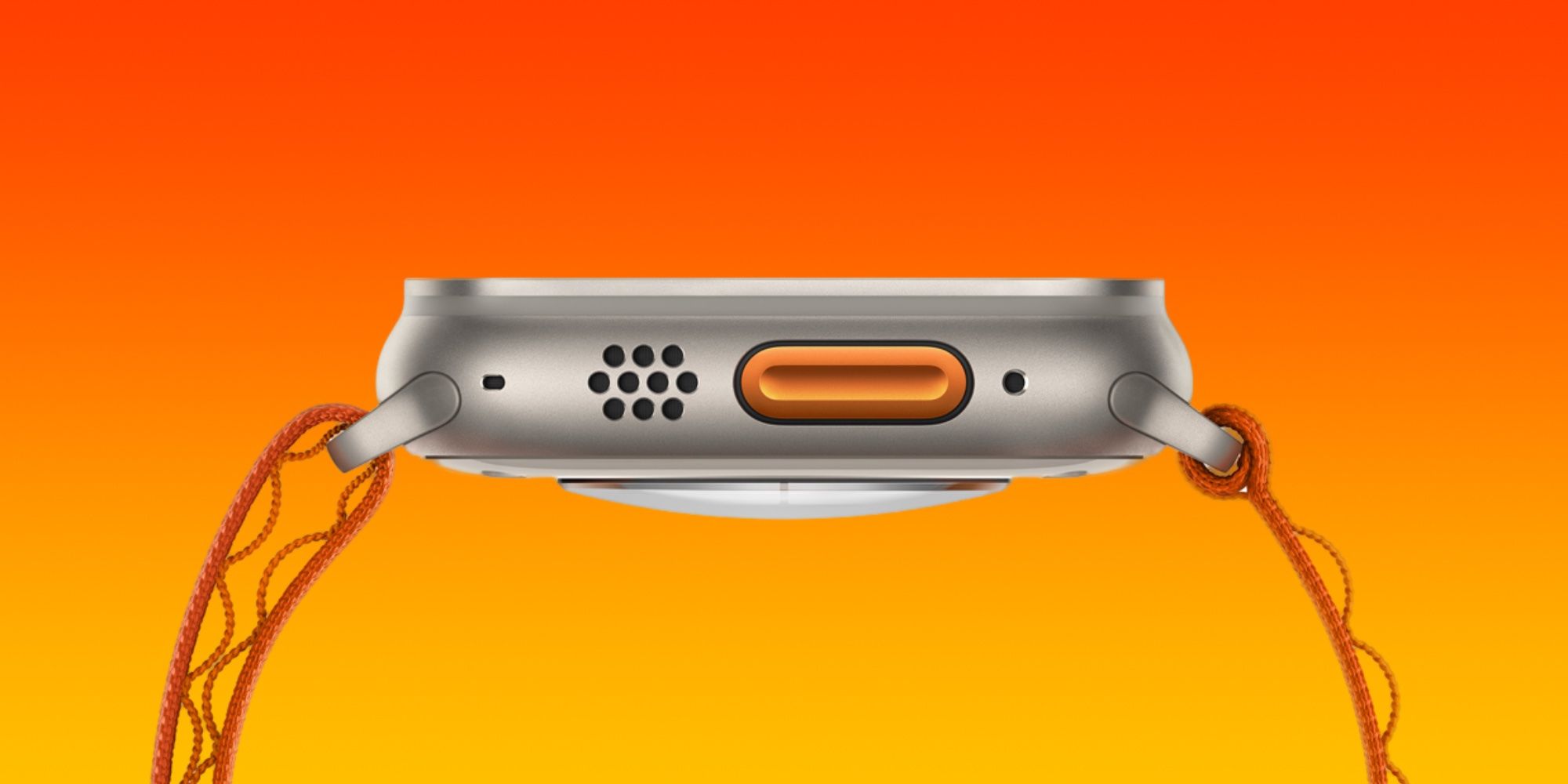 The side profile of the Apple Watch Ultra, showing off the international orange Action button.