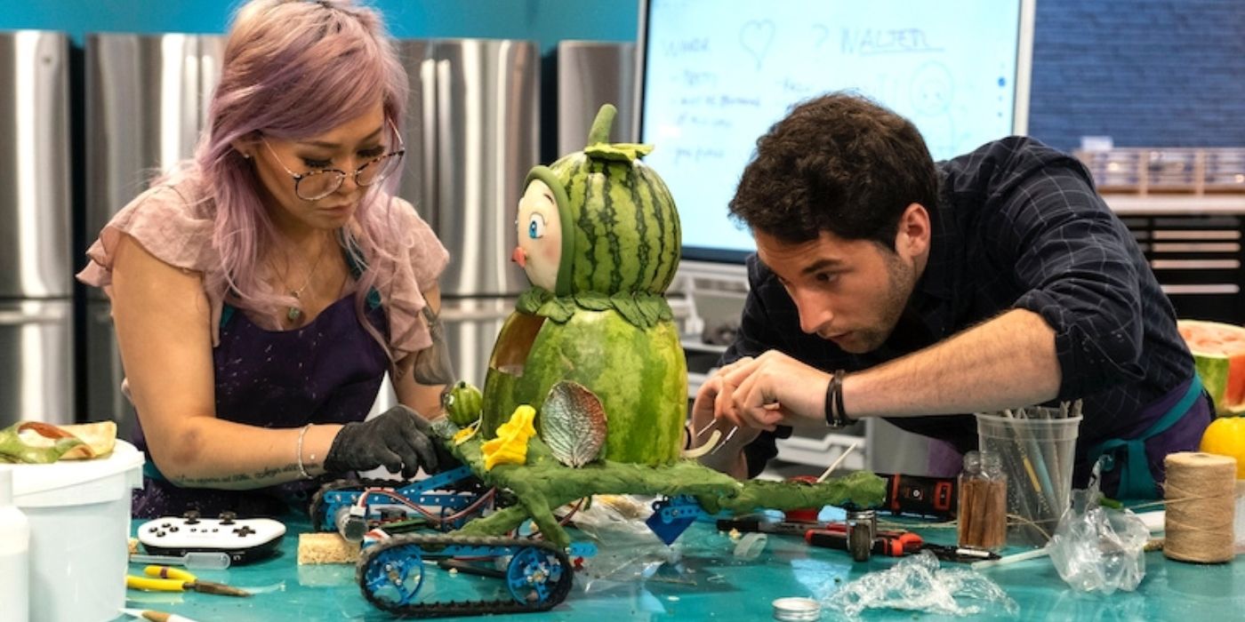 Contestants working on a sculpture in Baking Impossible