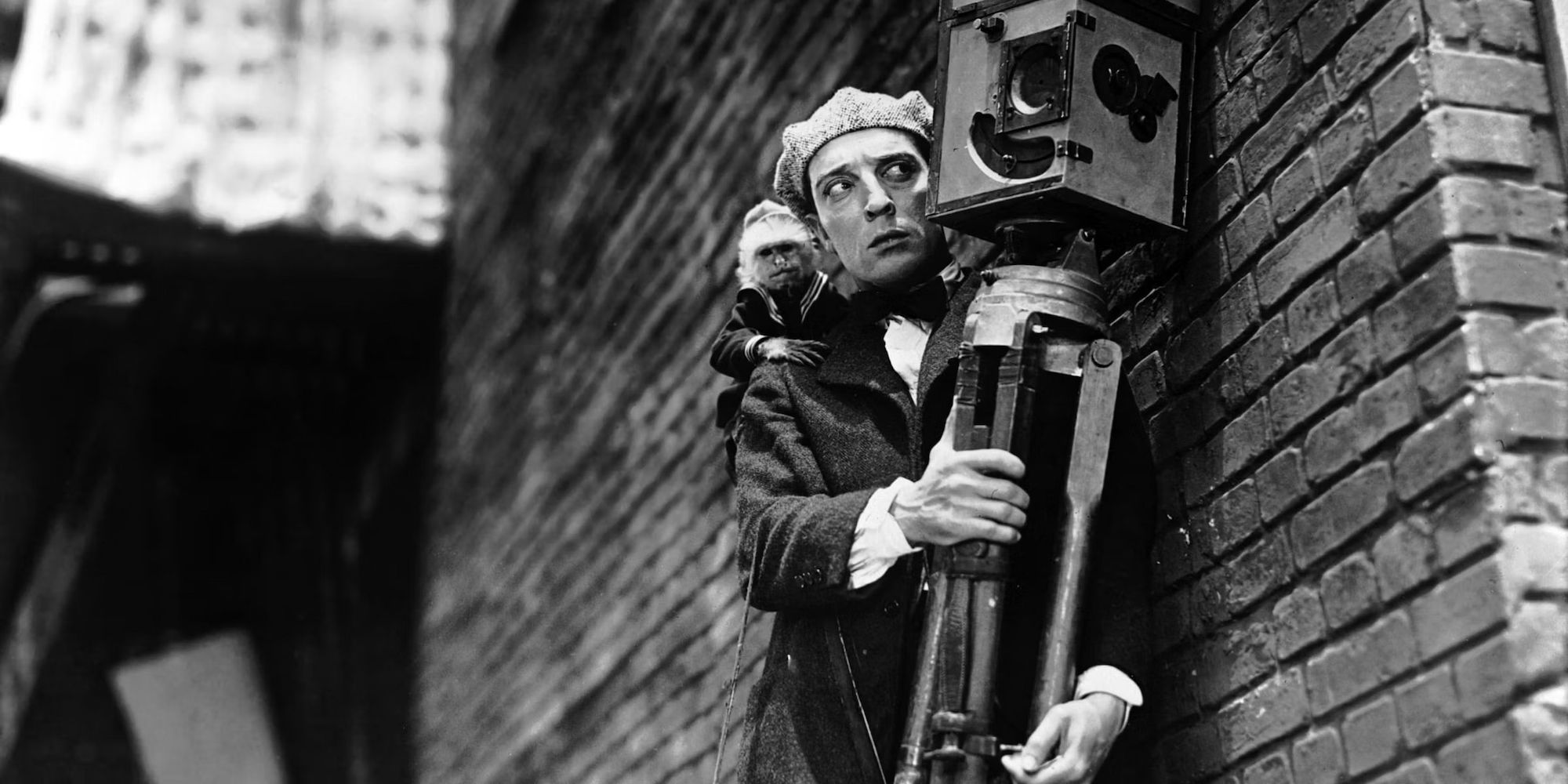 Buster Keaton holding a camera in The Cameraman
