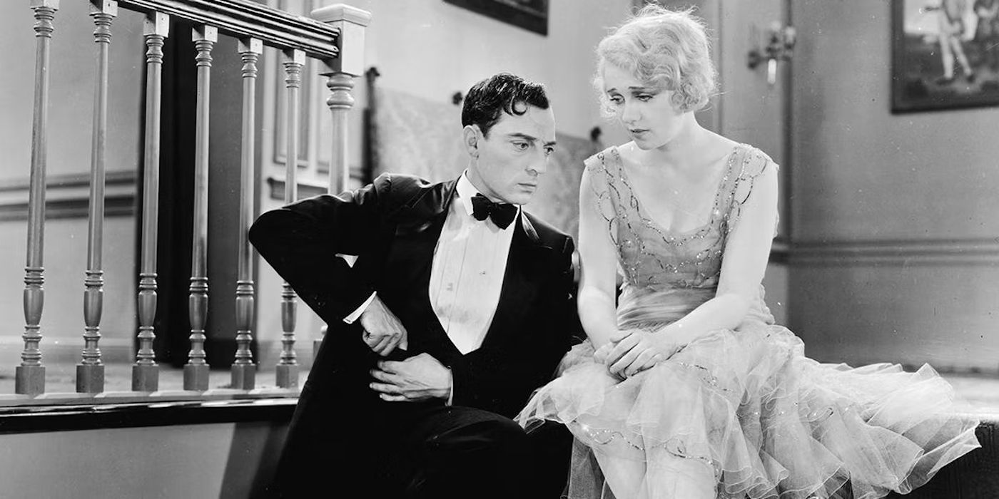 Buster Keaton sitting with a woman on a staircase in Free and Easy