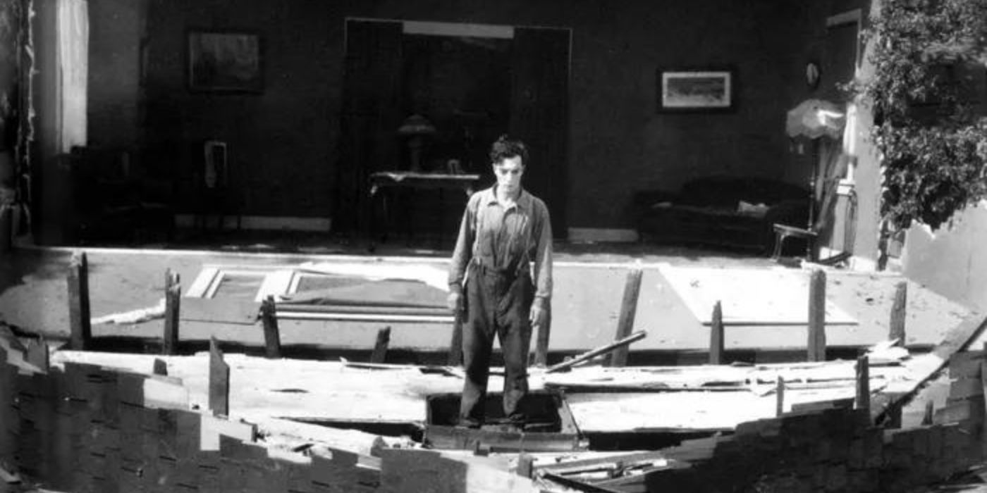 Buster Keaton standing with a fall house around him in Steamboat Bill Jr 