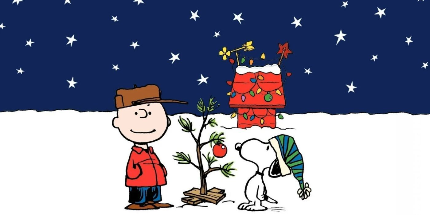 Charlie Brown and Snoopy looking at a small christmas tree in A Charlie Brown Christmas. 