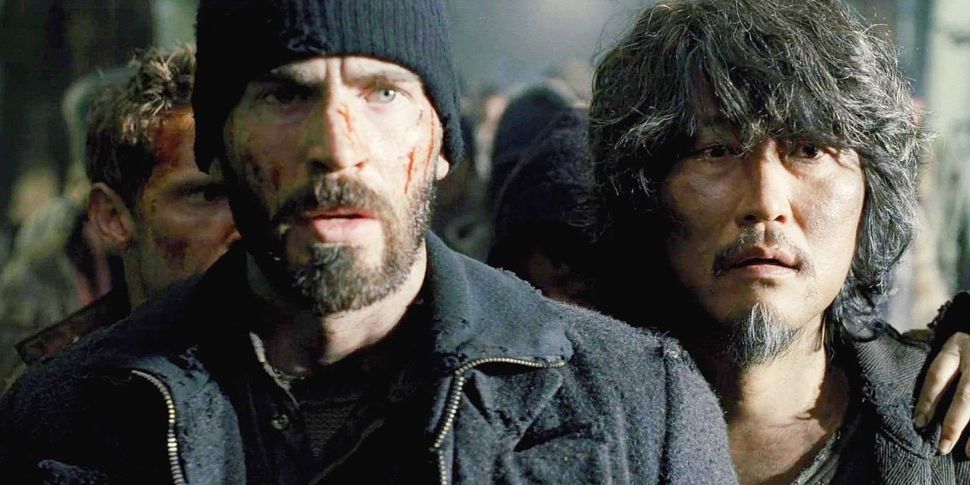 Chris Evans and Song Kang-Ho next to each other looking stunned in Snowpiercer